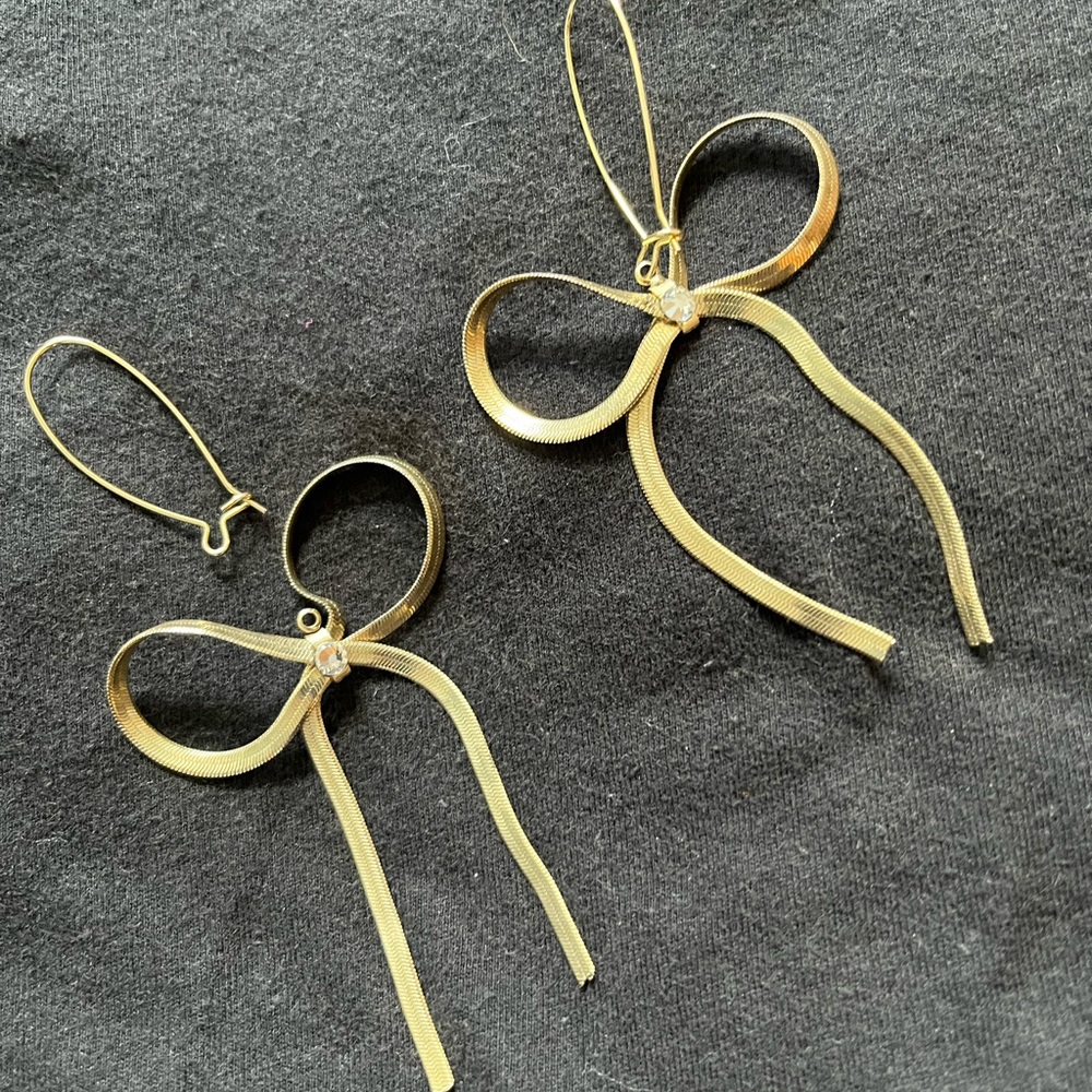 Betsey Johnson gold bow earrings with rhinestone accent